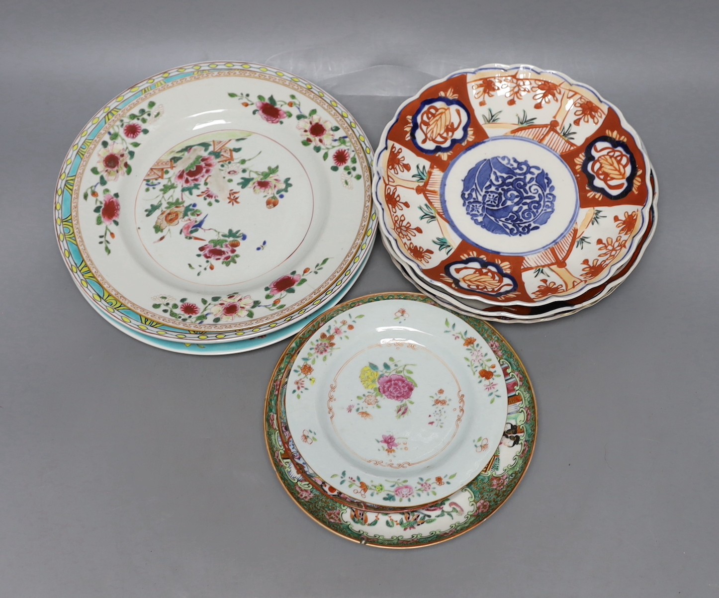 A collection of Chinese 19th and 20th century plates, together with Japanese Imari plates.